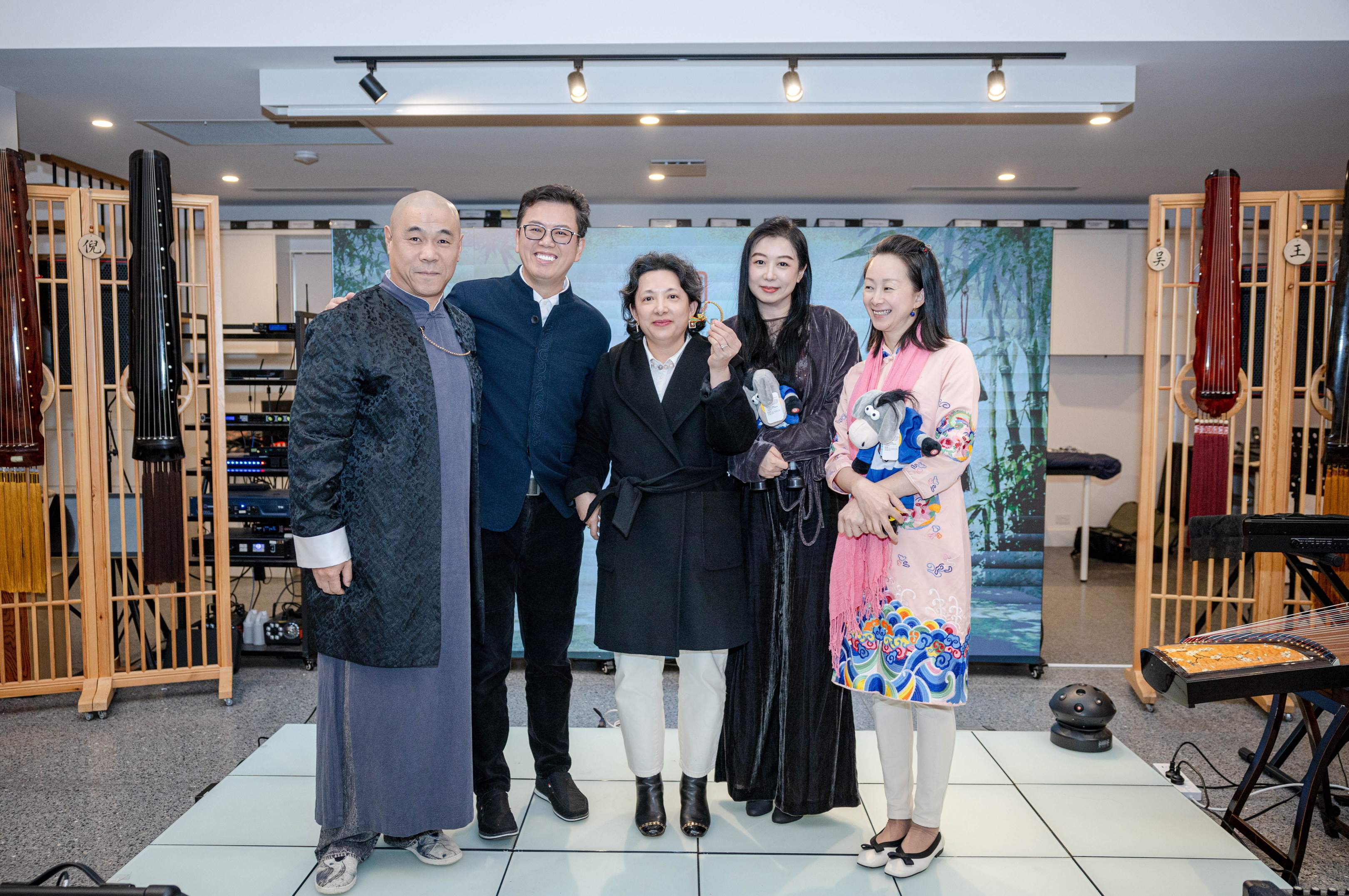 Guests standing together inside the guzheng salon venue.